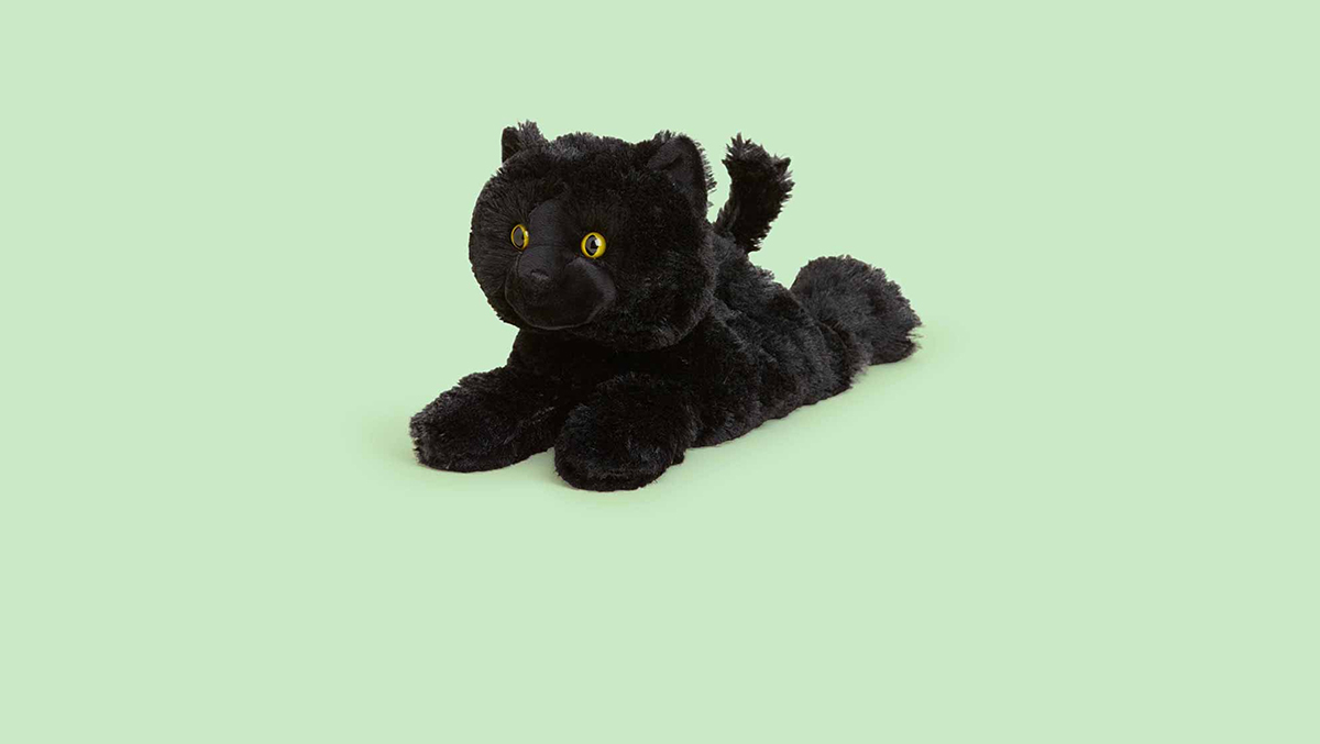 Image of Calico Cat Warmies and Laying Down Gray Cat Warmies side by side.